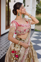 The Olive Green Shaded Brocade Silk Woven Lehenga Ensemble with Jharokha Embroidered Sweetheart Blouse and Attached Organza Dupatta