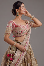 The Olive Green Shaded Brocade Silk Woven Lehenga Ensemble with Jharokha Embroidered Sweetheart Blouse and Attached Organza Dupatta