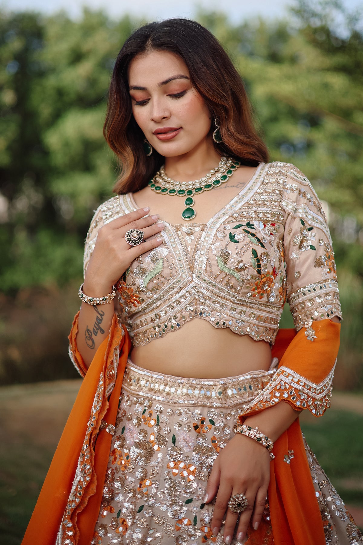 The Beige Gold Tissue Silk Kalidar Lehenga Ensemble with Hand-Embellished V-Shape Blouse and Scalloped Organza Dupatta