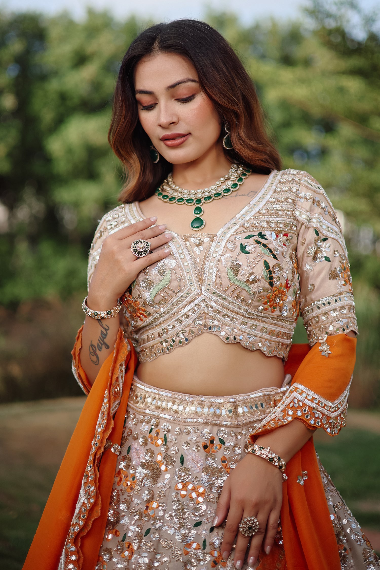 The Beige Gold Tissue Silk Kalidar Lehenga Ensemble with Hand-Embellished V-Shape Blouse and Scalloped Organza Dupatta