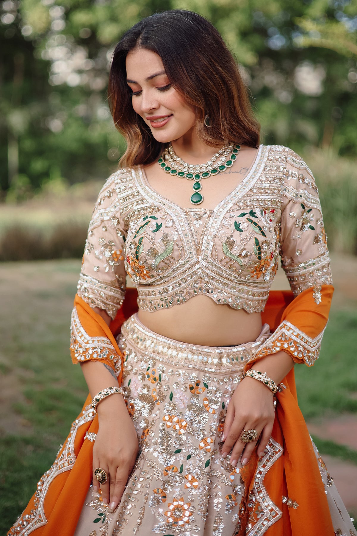 The Beige Gold Tissue Silk Kalidar Lehenga Ensemble with Hand-Embellished V-Shape Blouse and Scalloped Organza Dupatta