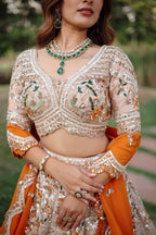 The Beige Gold Tissue Silk Kalidar Lehenga Ensemble with Hand-Embellished V-Shape Blouse and Scalloped Organza Dupatta