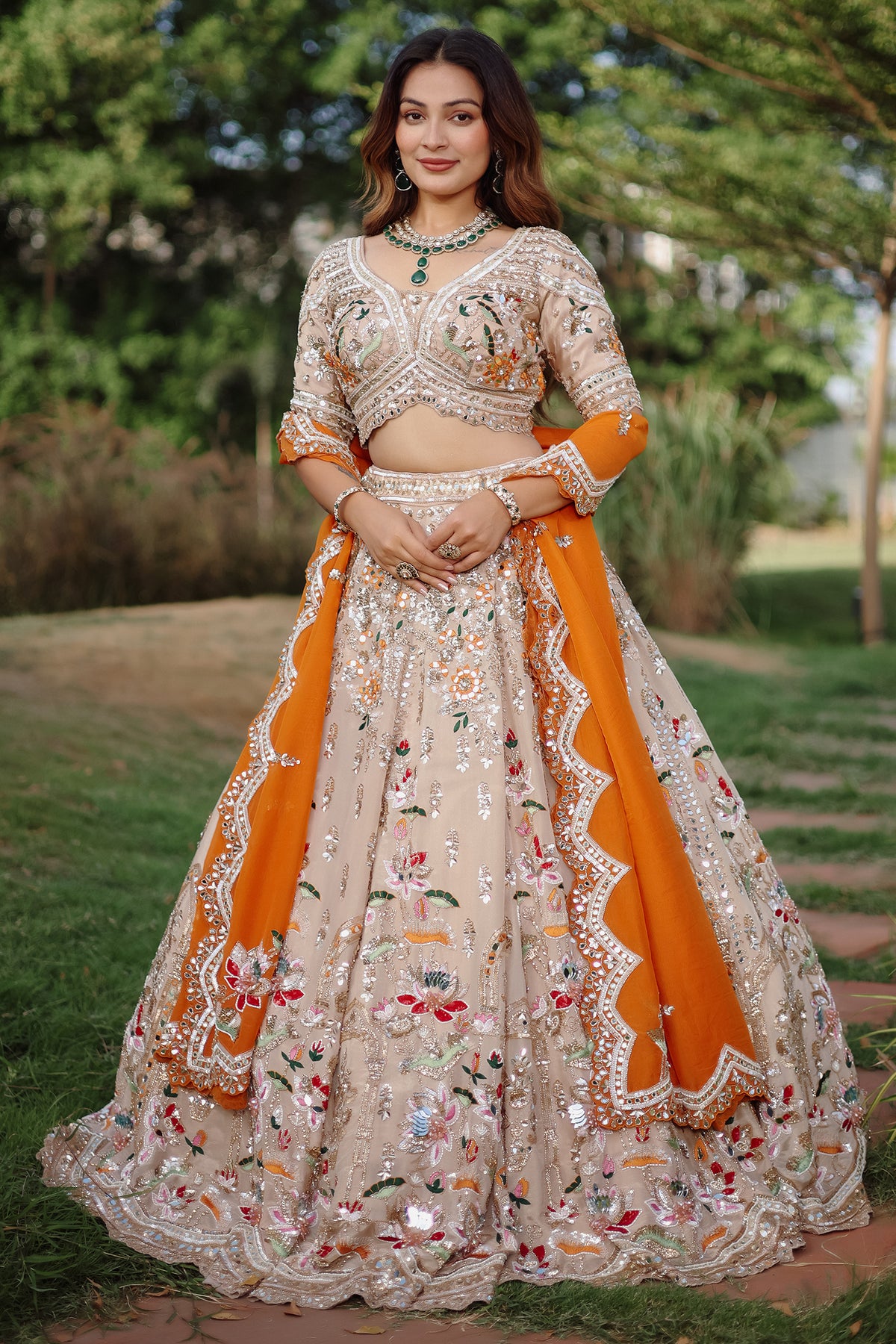 The Beige Gold Tissue Silk Kalidar Lehenga Ensemble with Hand-Embellished V-Shape Blouse and Scalloped Organza Dupatta