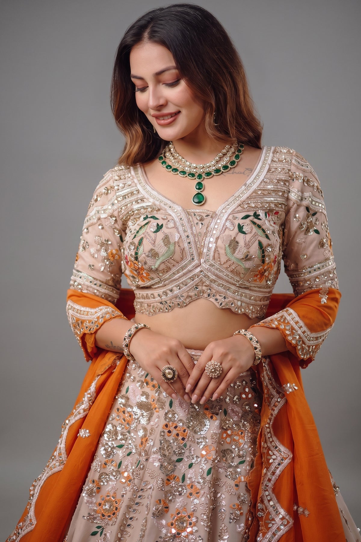 The Beige Gold Tissue Silk Kalidar Lehenga Ensemble with Hand-Embellished V-Shape Blouse and Scalloped Organza Dupatta