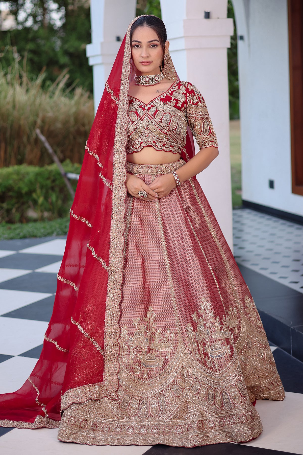 The Majestic Maroon Banarasi Silk Bridal Lehenga Ensemble with Jharokha Zardosi Blouse and Sheer Scalloped Veil