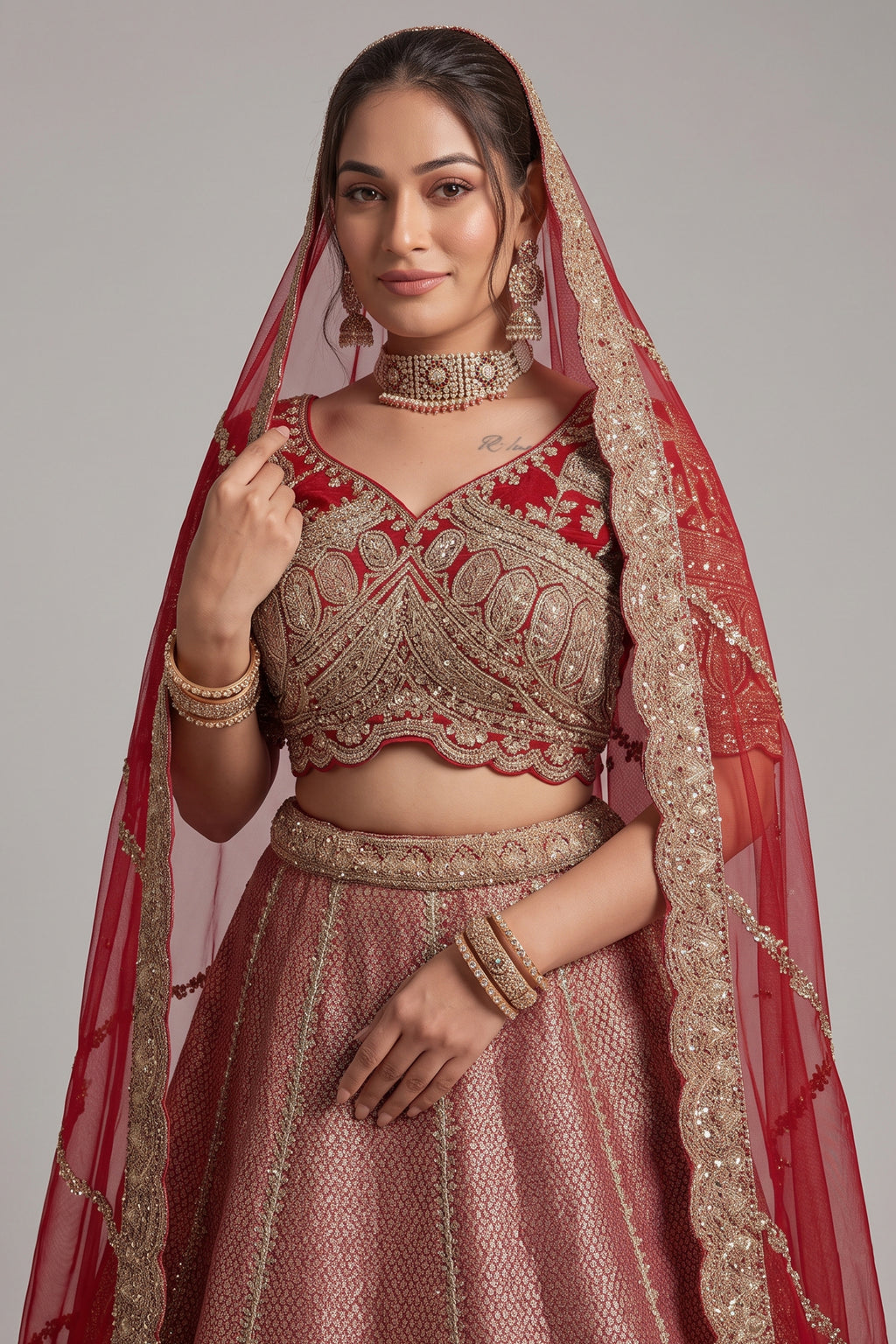 The Majestic Maroon Banarasi Silk Bridal Lehenga Ensemble with Jharokha Zardosi Blouse and Sheer Scalloped Veil