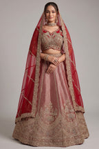 The Majestic Maroon Banarasi Silk Bridal Lehenga Ensemble with Jharokha Zardosi Blouse and Sheer Scalloped Veil