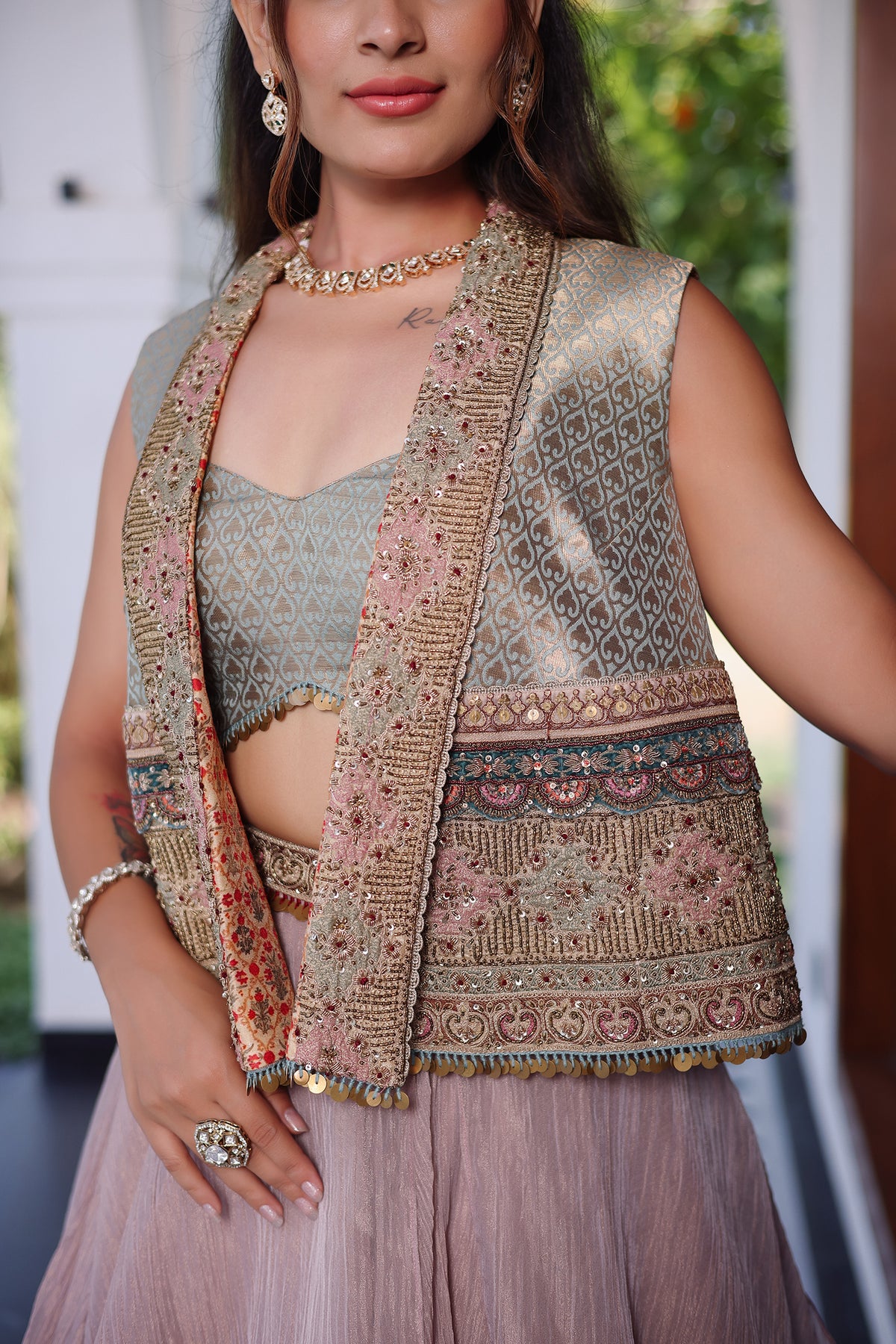Muted Mauve Tissue Asymmetric Layered Lehenga Set With Heavily Embroidered Fusion Jacket
