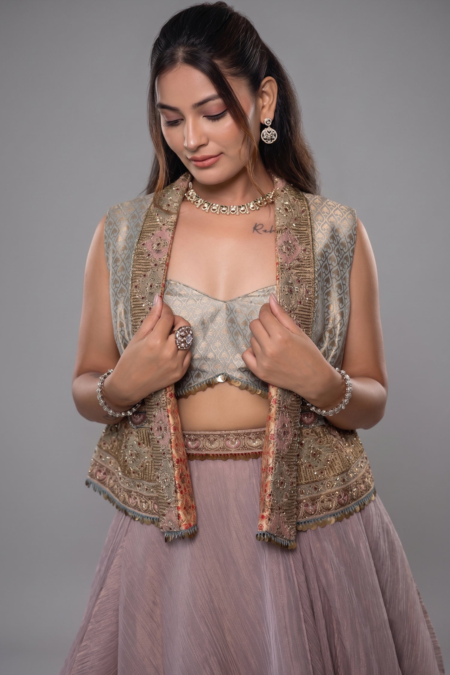 Muted Mauve Tissue Asymmetric Layered Lehenga Set With Heavily Embroidered Fusion Jacket Secondary image