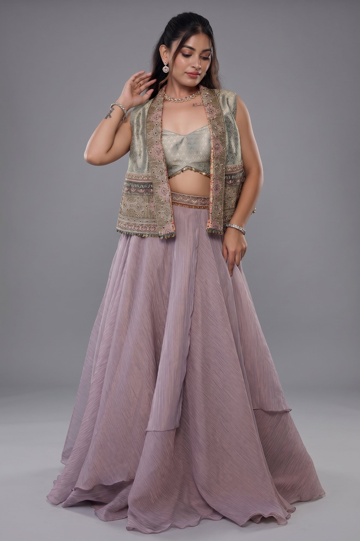 Muted Mauve Tissue Asymmetric Layered Lehenga Set With Heavily Embroidered Fusion Jacket Main image
