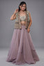 Muted Mauve Tissue Asymmetric Layered Lehenga Set With Heavily Embroidered Fusion Jacket