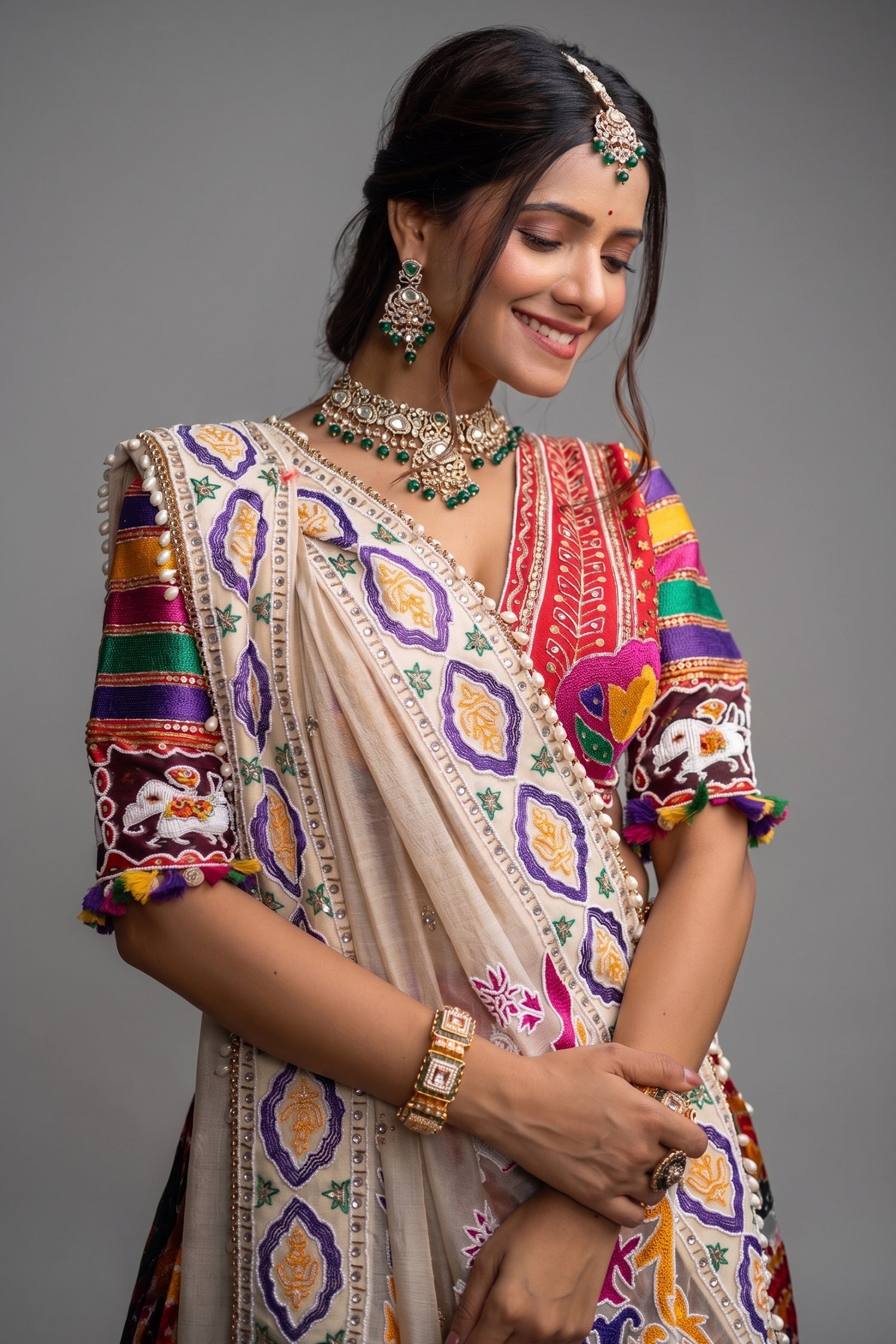 The Rajwadi Patola Silk Lehenga Ensemble With Scalloped V-Neck Hand-Embellished Blouse And Sheer Organza Tissue Dupatta