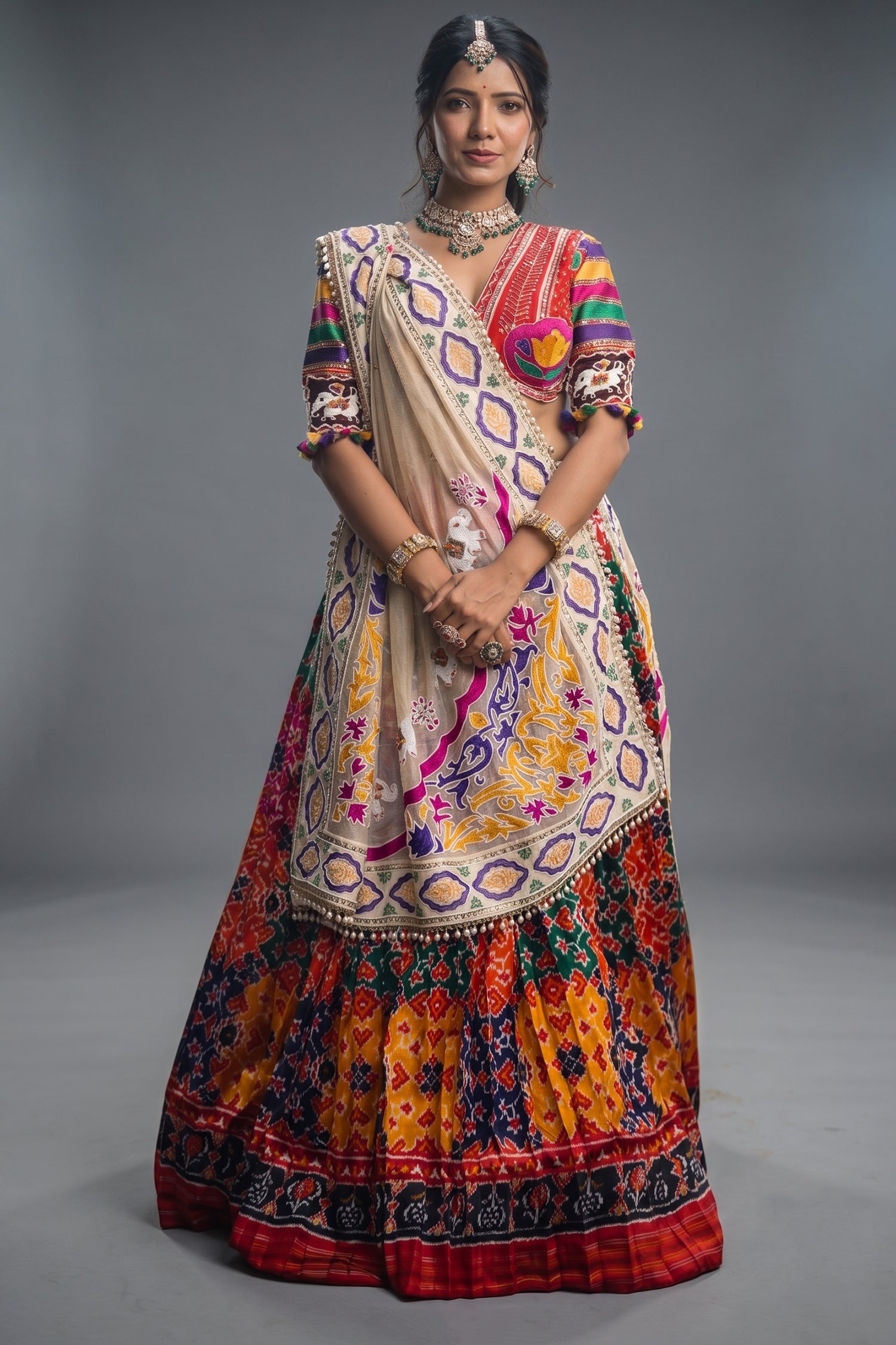 The Rajwadi Patola Silk Lehenga Ensemble With Scalloped V-Neck Hand-Embellished Blouse And Sheer Organza Tissue Dupatta Main image