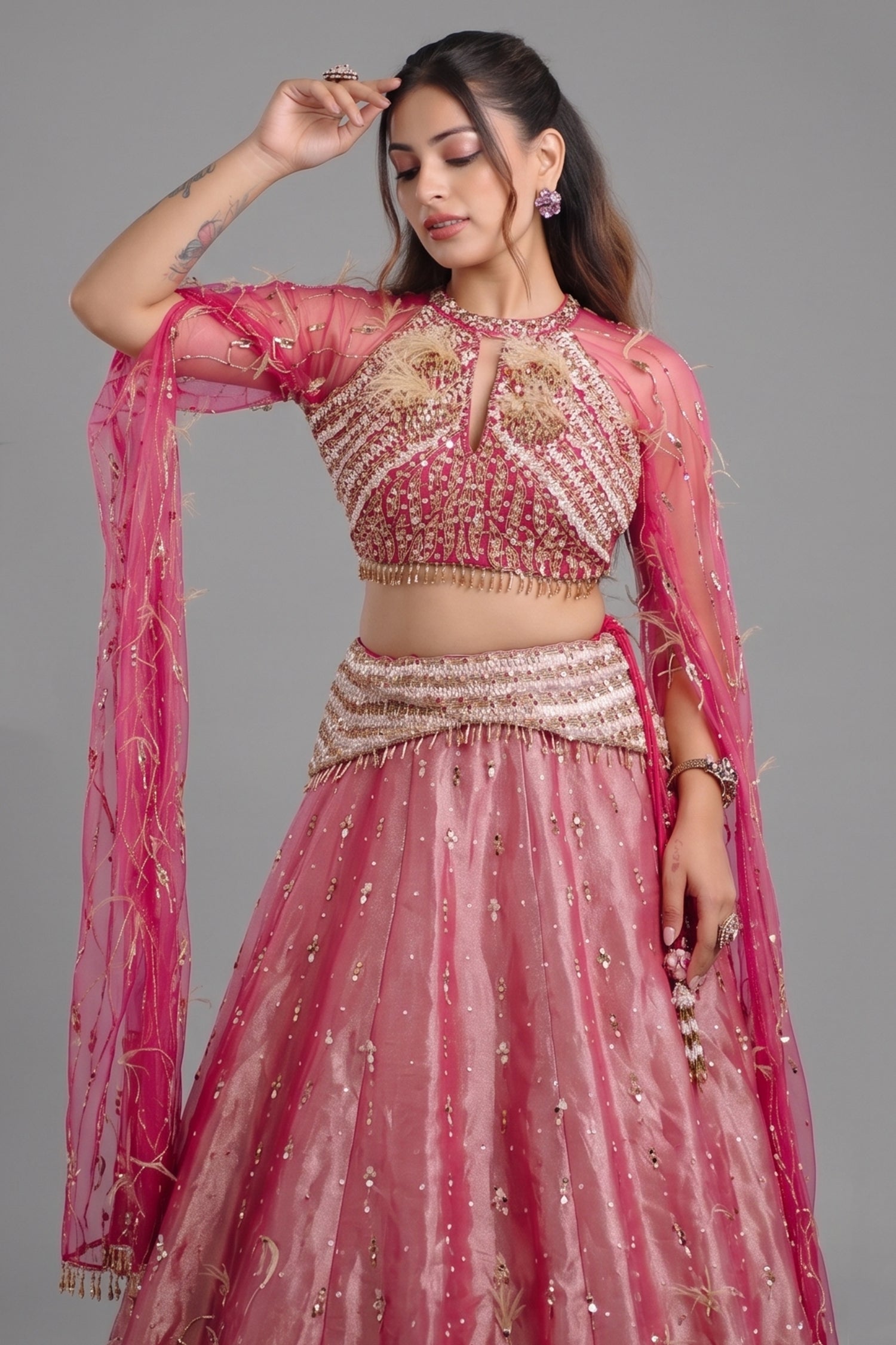 The Fuchsia Pink Ombre Tissue Lehenga Ensemble with High-Neck Keyhole Blouse and Floor-Length Feather Cape Sleeves Secondary image
