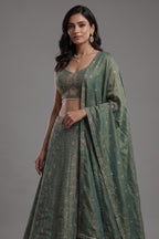 Sage Green Metallic Tissue Lehenga Set with Curvilinear Aari Sequin Work and Cutdana Blouse