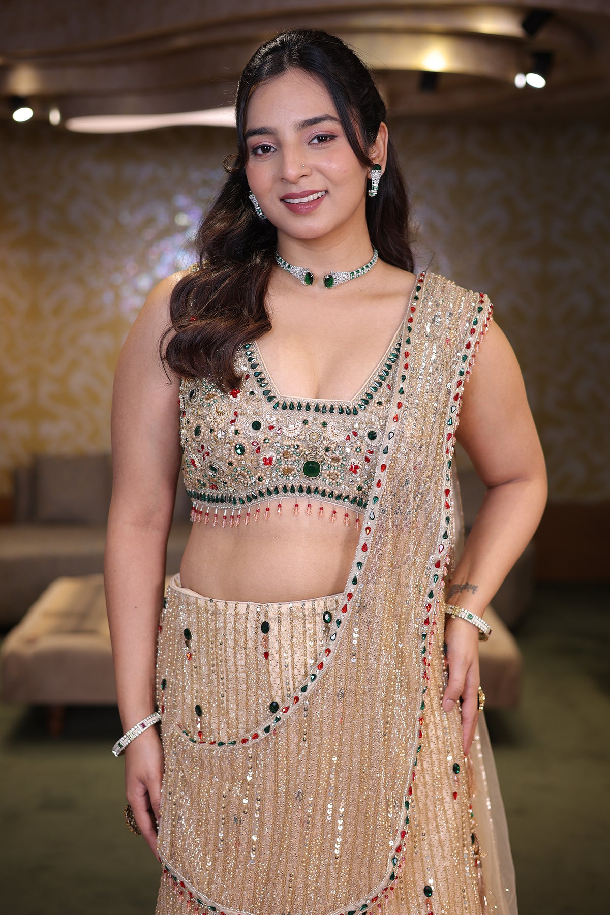 Champagne Gold Net Panelled Lehenga Set with Jewel-Encrusted Emerald Cutdana and Ruby Stone Work