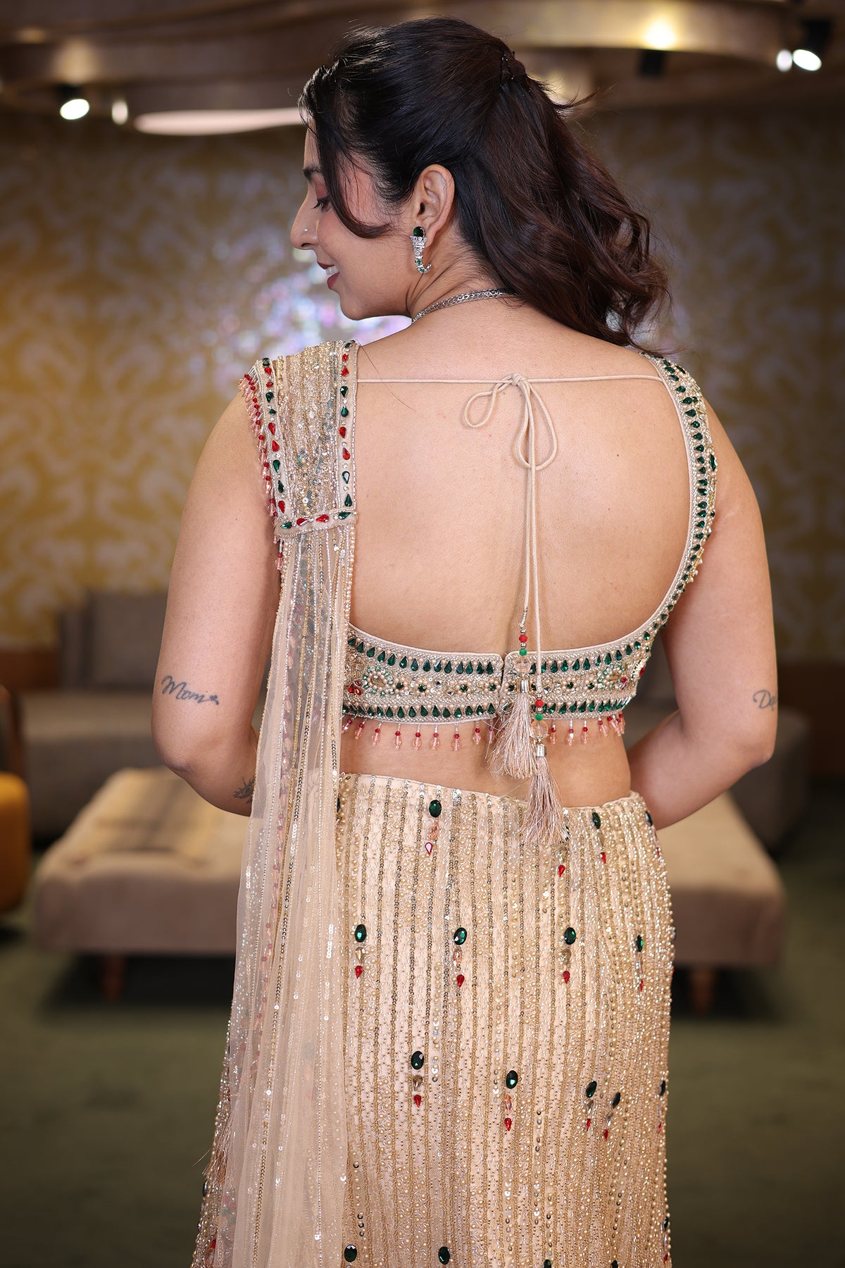Champagne Gold Net Panelled Lehenga Set with Jewel-Encrusted Emerald Cutdana and Ruby Stone Work