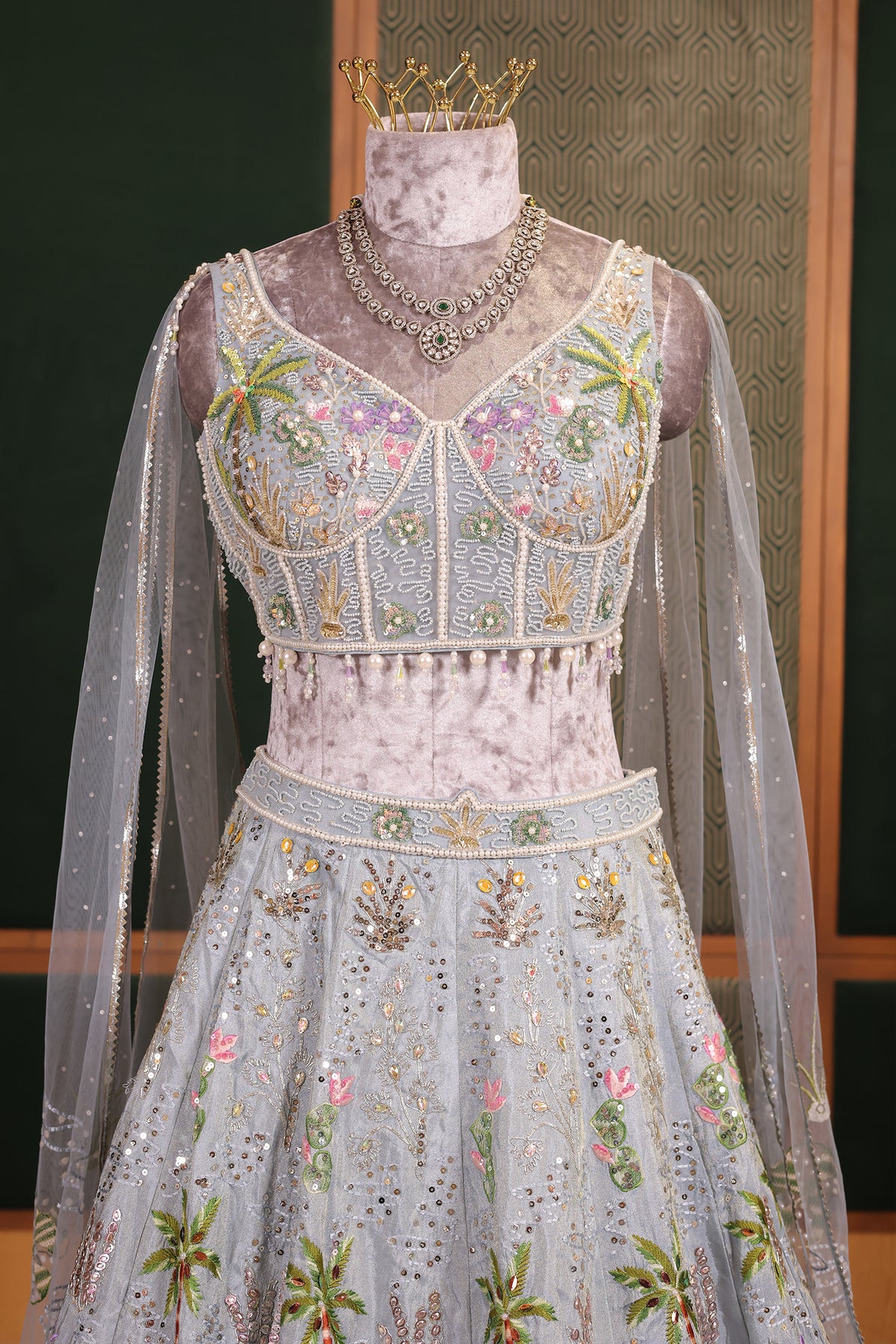 Powder Blue Tissue Flared Lehenga Skirt with Cutdana Embroidered Net Bustier and Sequin Cape Sleeves