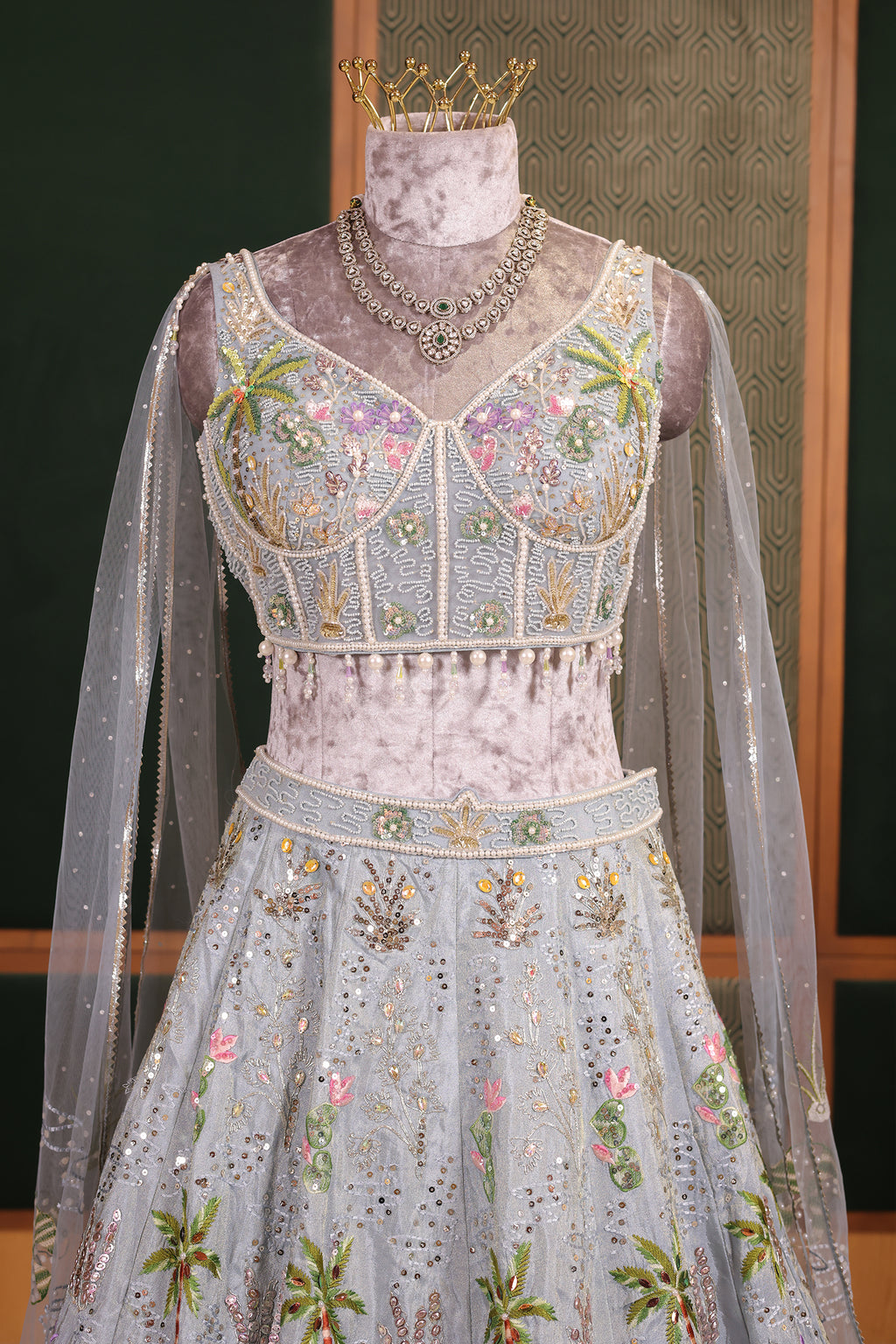 Powder Blue Tissue Flared Lehenga Skirt with Cutdana Embroidered Net Bustier and Sequin Cape Sleeves