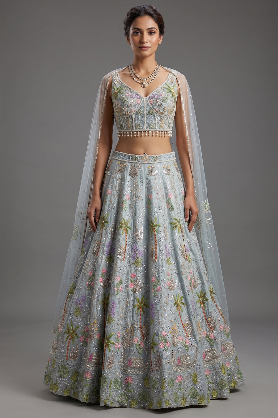 Powder Blue Tissue Flared Lehenga Skirt with Cutdana Embroidered Net Bustier and Sequin Cape Sleeves