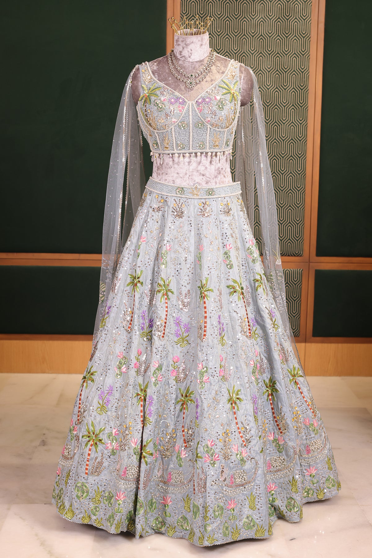 Powder Blue Tissue Flared Lehenga Skirt with Cutdana Embroidered Net Bustier and Sequin Cape Sleeves