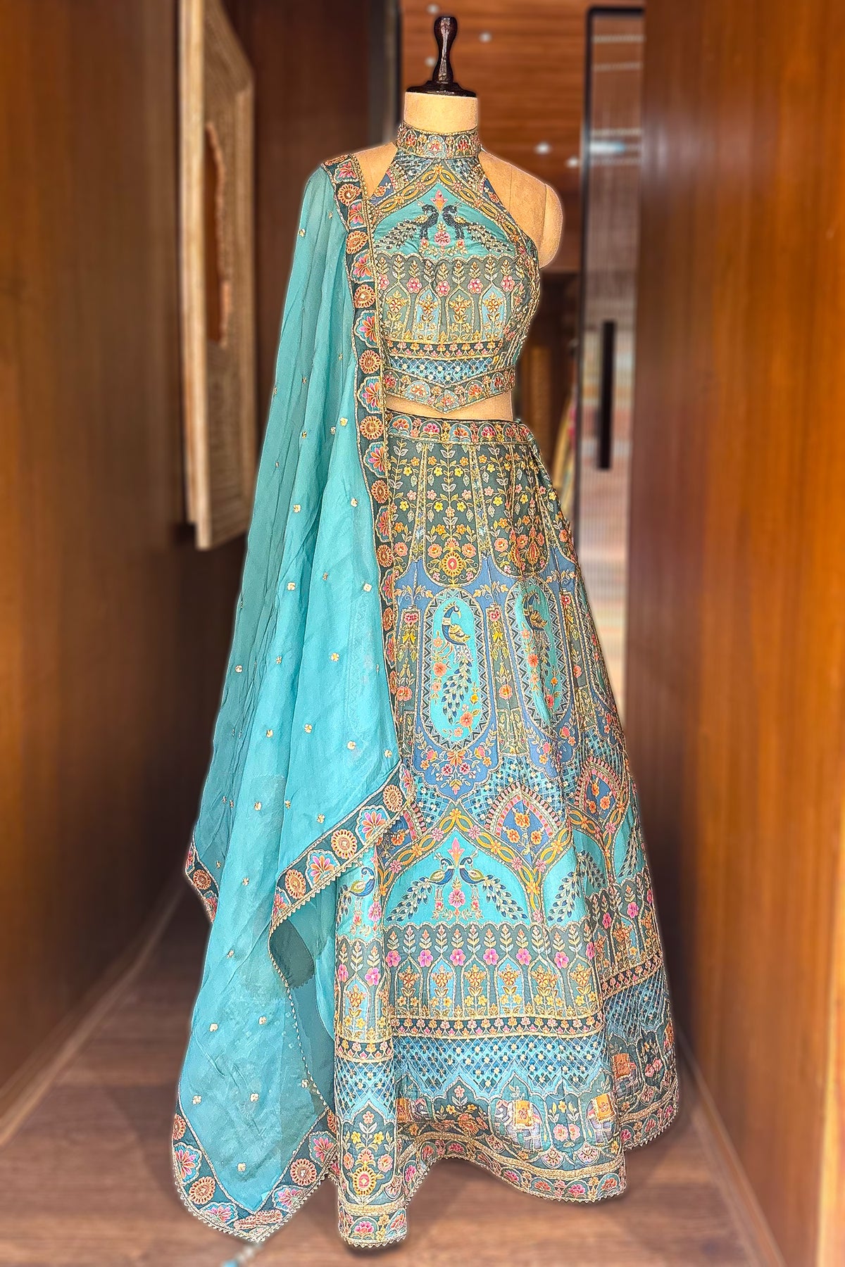 Firuza Blue Silk Pichwai Printed Lehenga with Mirror and Sequin Embroidered Halter Blouse
