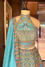 Firuza Blue Silk Pichwai Printed Lehenga with Mirror and Sequin Embroidered Halter Blouse