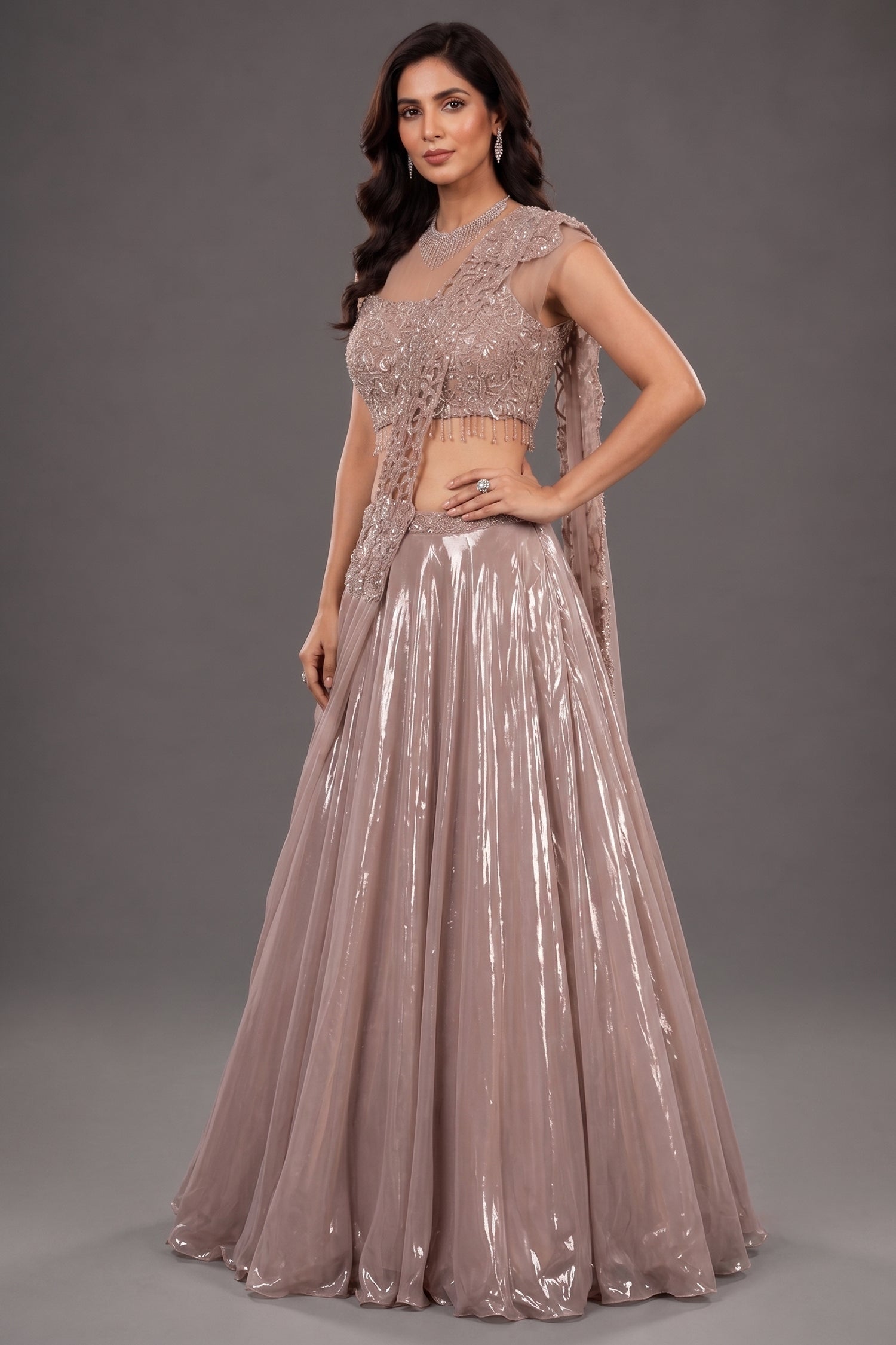 Metallic Dusty Rose Glass Tissue Flared Lehenga Skirt with Encrusted Cutdana Drape Blouse Main image