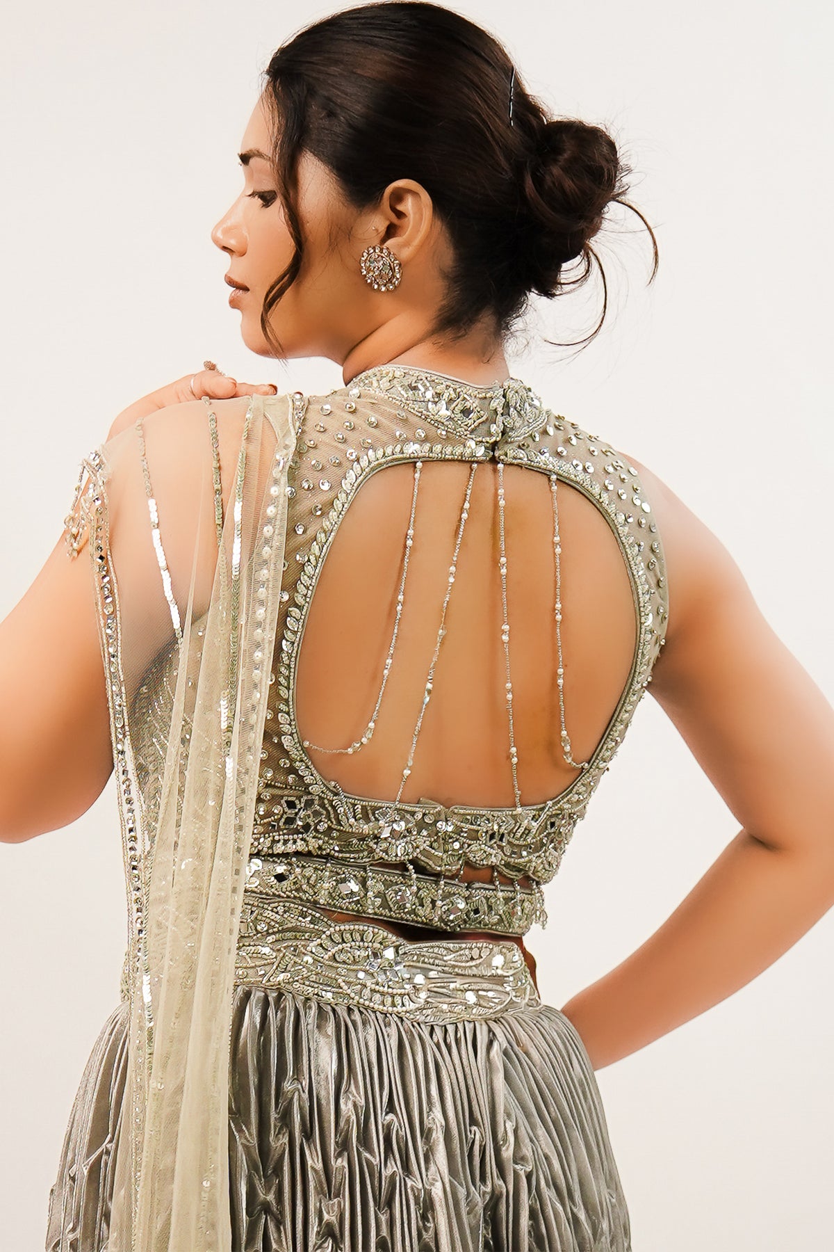 Metallic Green Smocked Satin Lehenga Set with Mirror-Embellished High-Neck Blouse