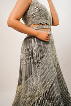 Metallic Green Smocked Satin Lehenga Set with Mirror-Embellished High-Neck Blouse