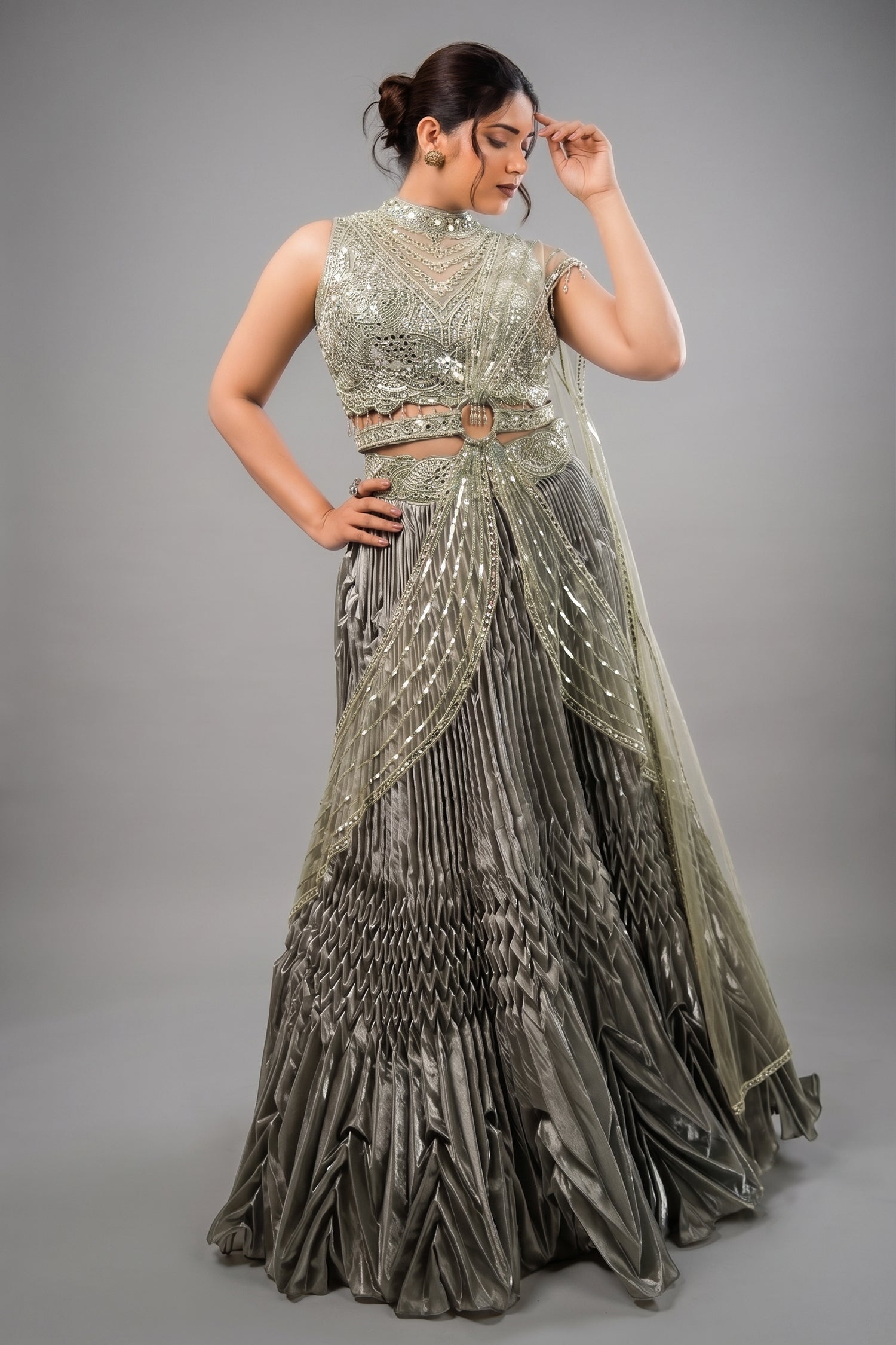 Metallic Green Smocked Satin Lehenga Set with Mirror-Embellished High-Neck Blouse Main image
