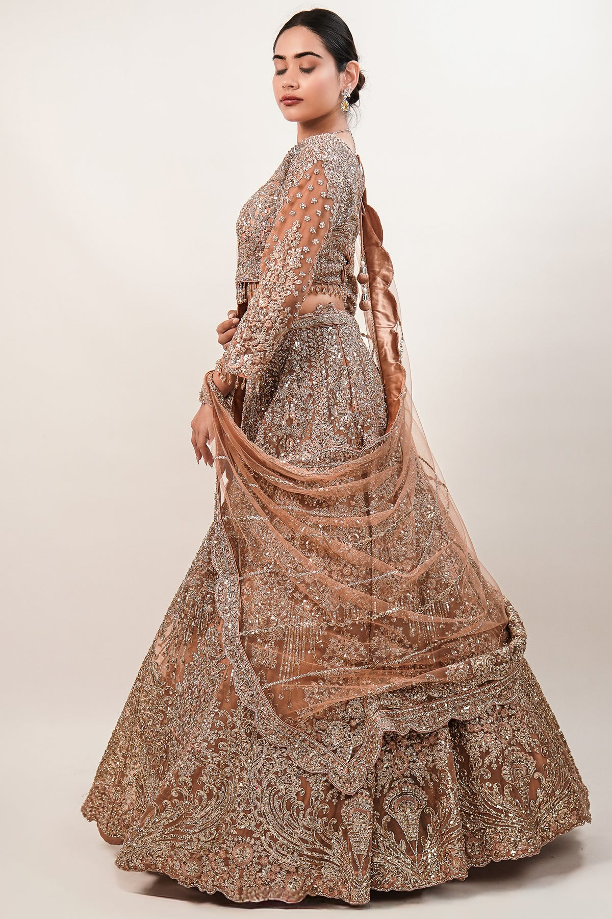 Rose Gold Beige Net Lehenga with Heavily Handcrafted Work