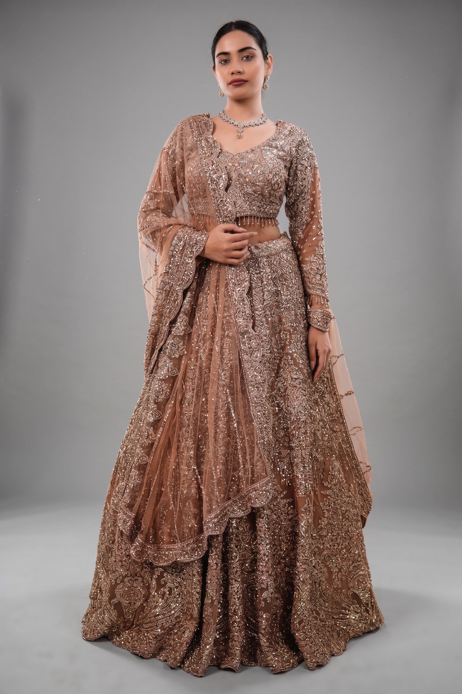 Rose Gold Beige Net Lehenga with Heavily Handcrafted Work Main image