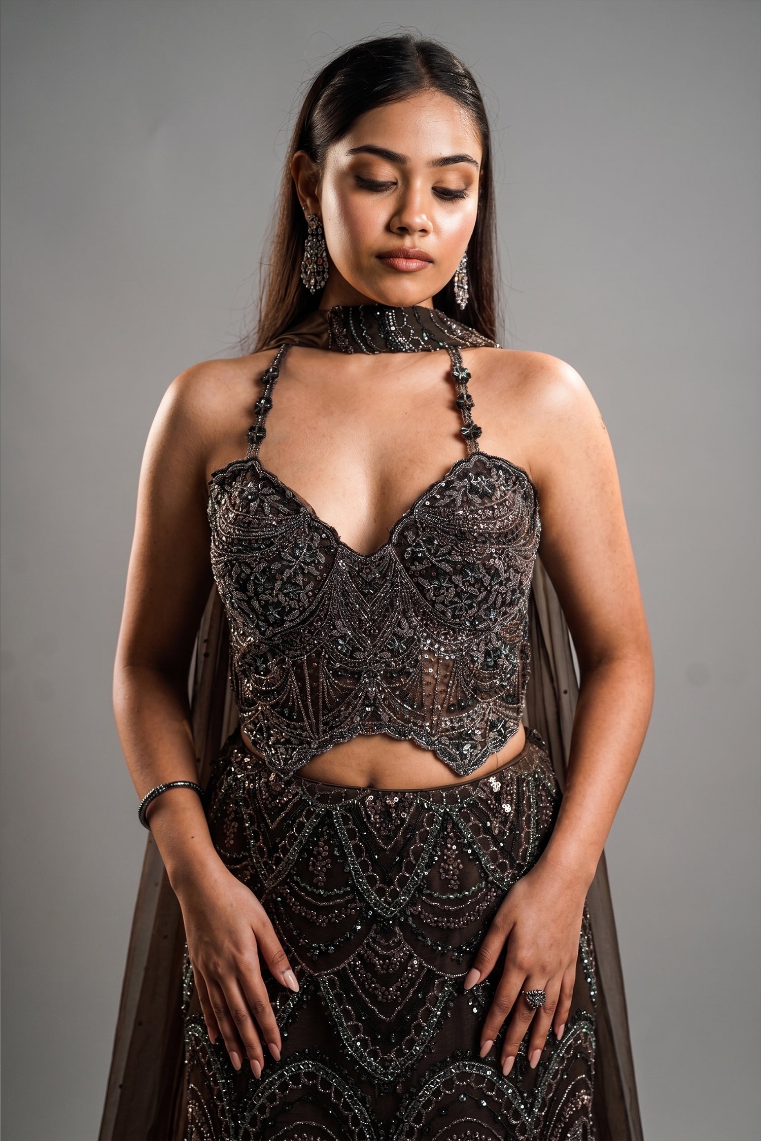 Charcoal Brown Net Lehenga Set with Wave-Patterned Cutdana and Sequin Sweetheart Bustier Secondary image