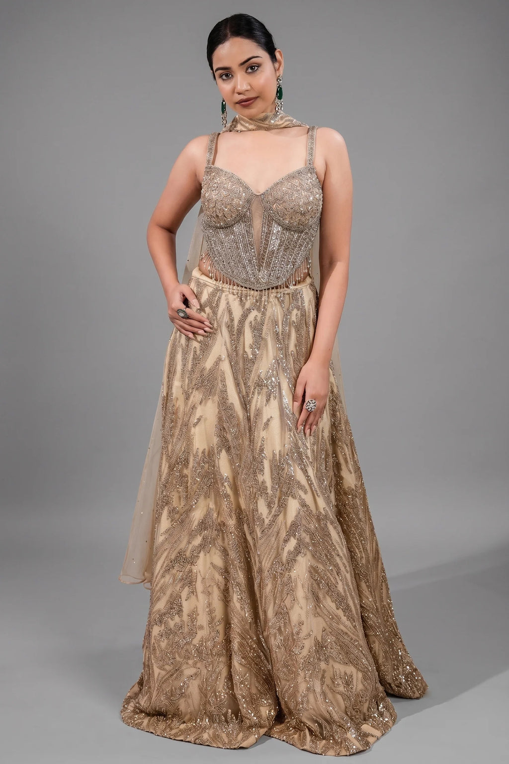 Champagne Beige Net Lehenga featuring Linear Sequin Trails and Beaded Tassel Bustier