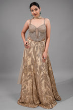 Champagne Beige Net Lehenga featuring Linear Sequin Trails and Beaded Tassel Bustier
