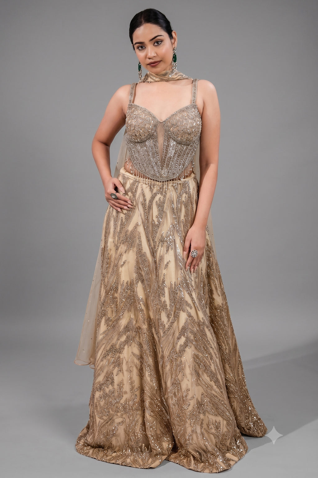 Champagne Beige Net Lehenga featuring Linear Sequin Trails and Beaded Tassel Bustier