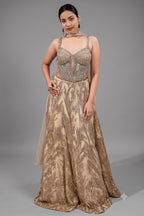Champagne Beige Net Lehenga featuring Linear Sequin Trails and Beaded Tassel Bustier
