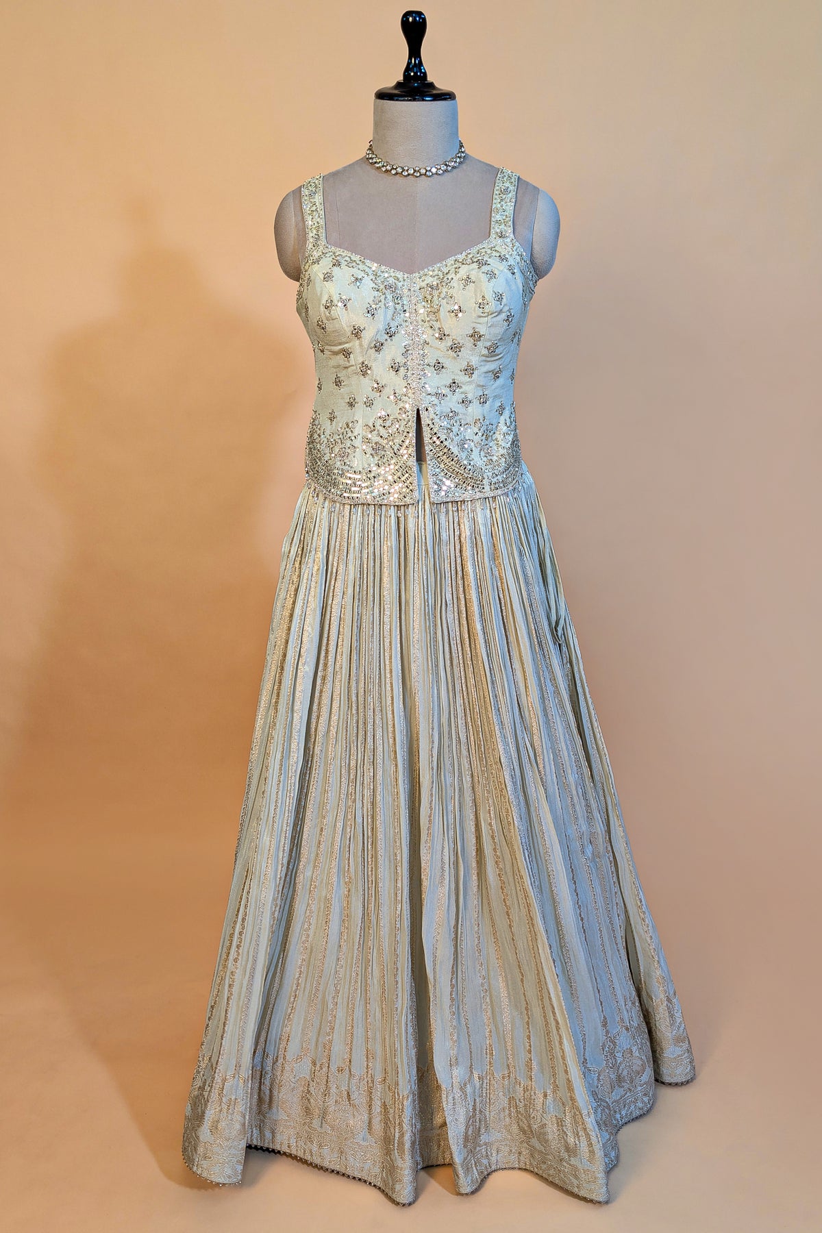 Cream Tissue Woven Pelated Lehenga with Mirror Work Blouse
