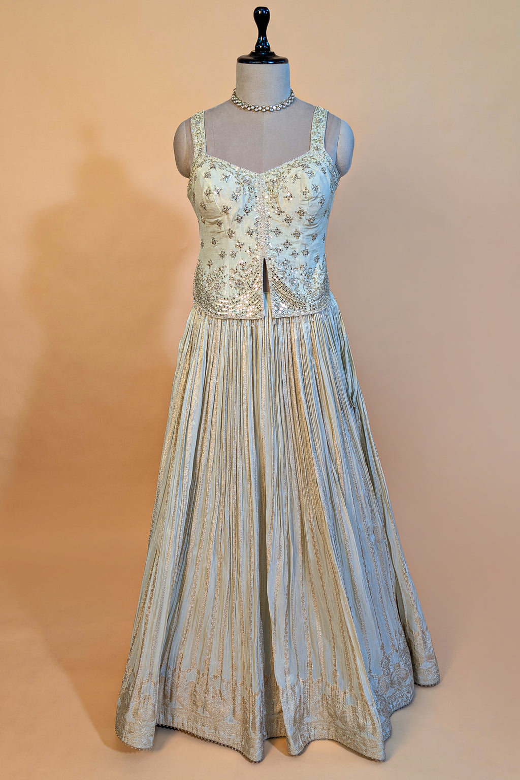 Cream Tissue Woven Pelated Lehenga with Mirror Work Blouse