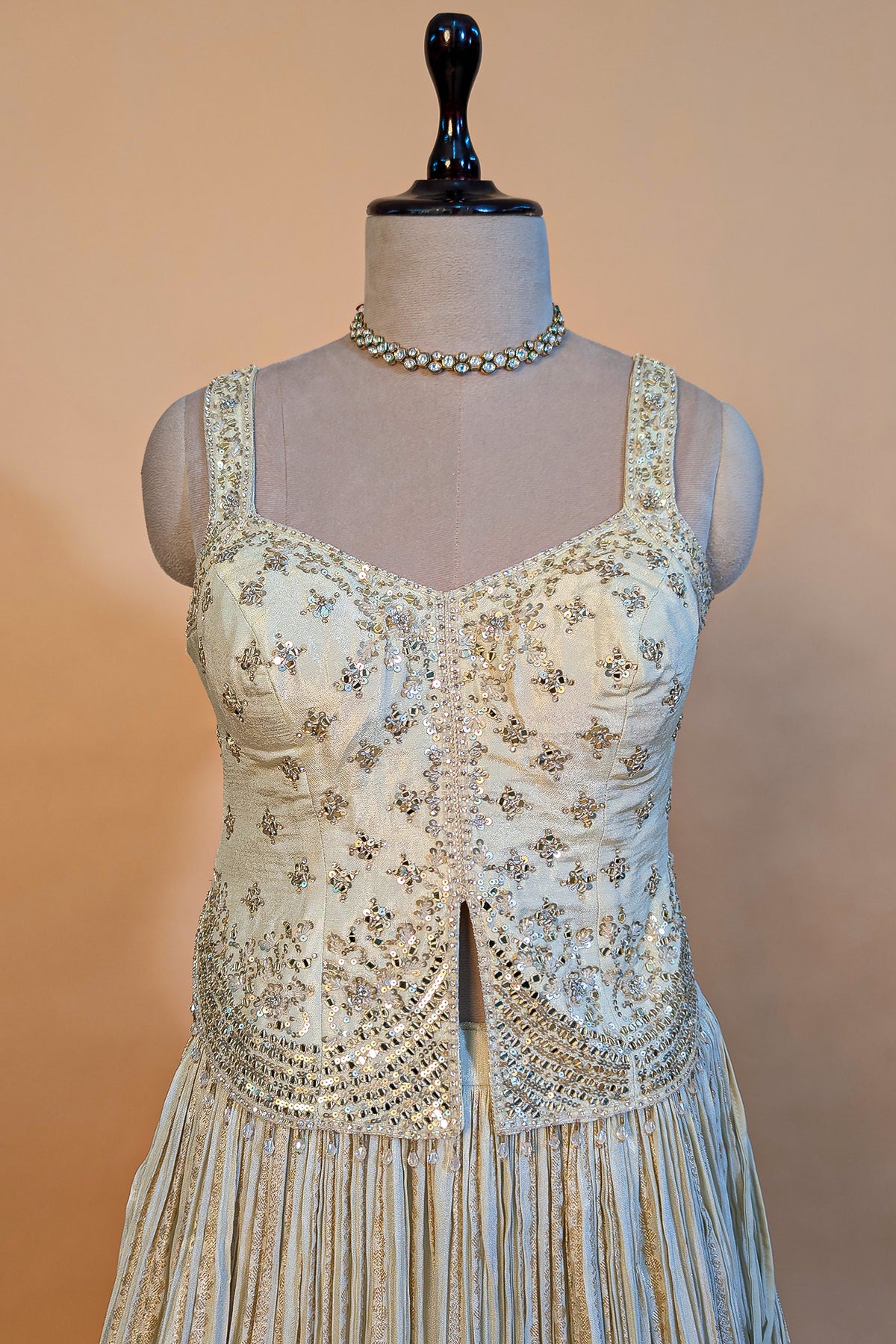 Cream Tissue Woven Pelated Lehenga with Mirror Work Blouse