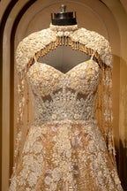 Plunging V-neckline and bodice details of the Champagne Gold Net Couture Gown