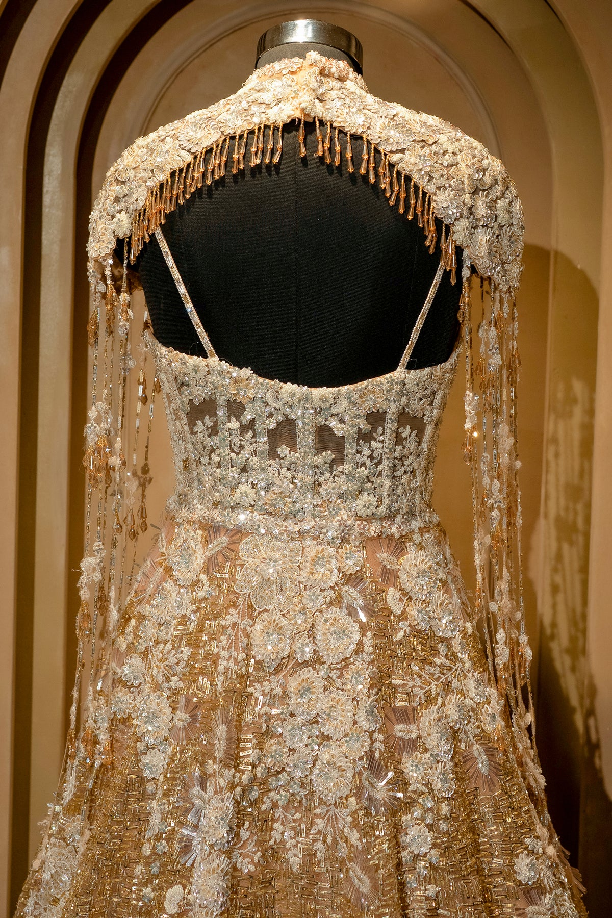 Designer Champagne Gold Net Couture Gown for grand receptions