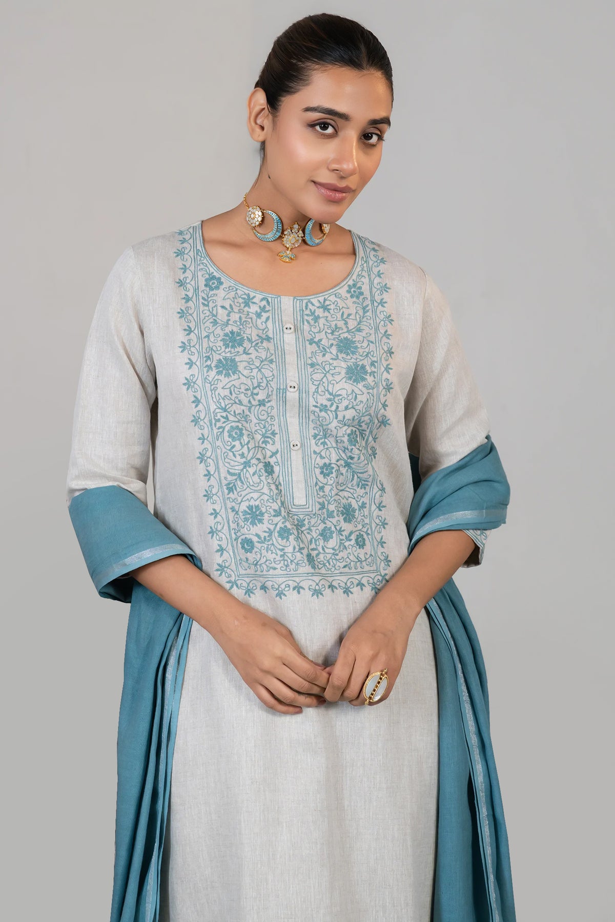 Close up of the vibrant contrast embroidery on Off White Linen Kurti Set