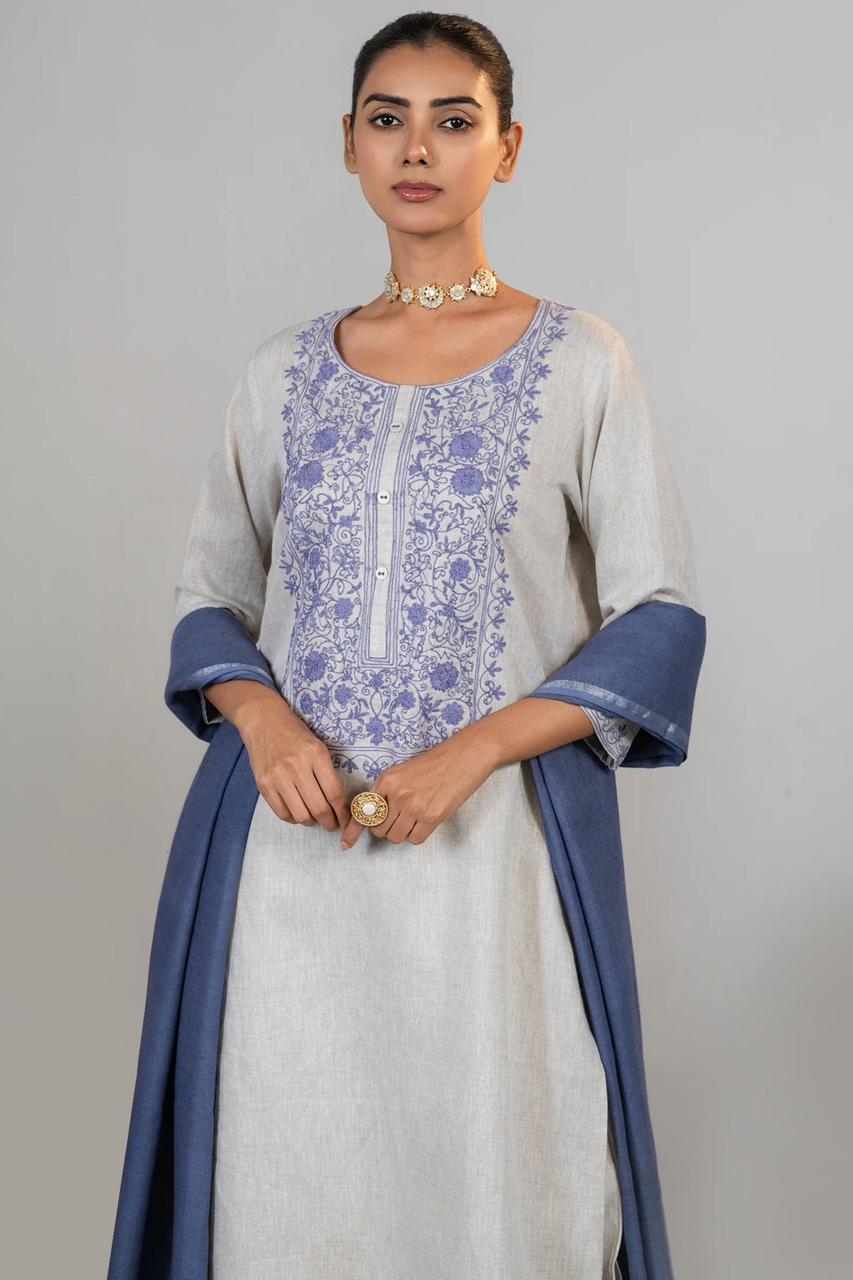 Close up of the vibrant contrast embroidery on Off White Linen Kurti Set