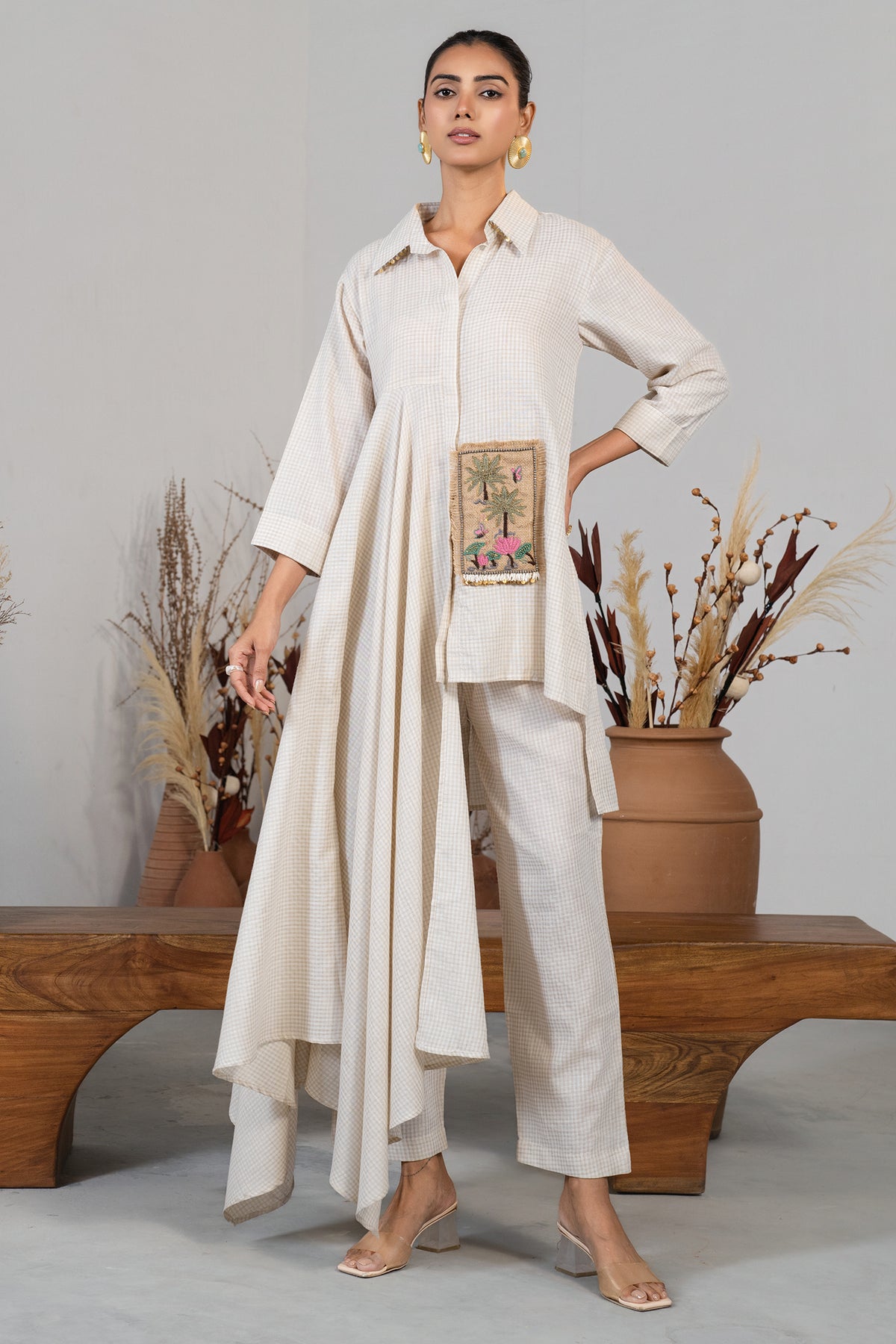 Full length dynamic silhouette of the Ivory White Jute Lapel Collar Clyde Asymmetric Co-Ord Set
