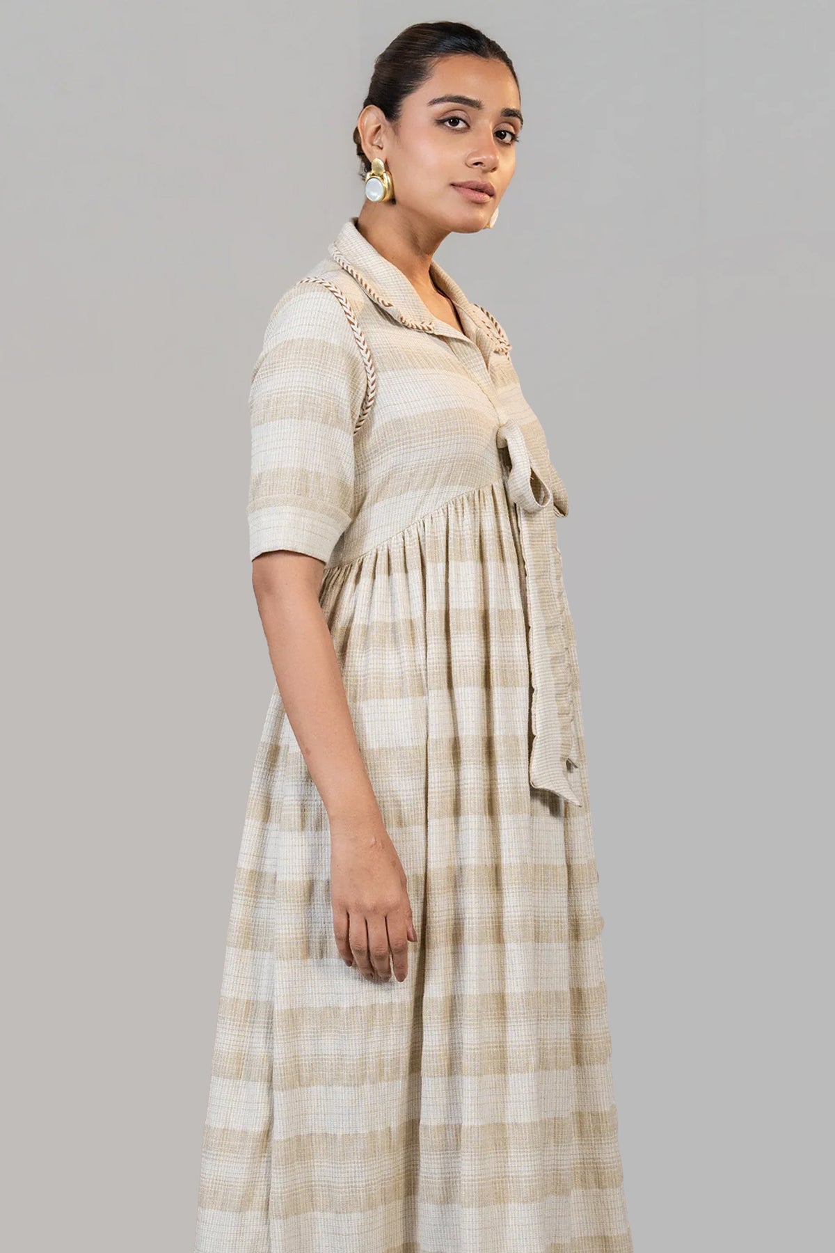 Close up of the organic jute blend texture and embroidery on Ivory Jute Embroidered Tie Up Dress