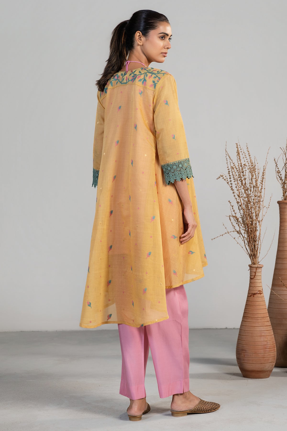 Full length silhouette of contemporary Light Pink and Orange Co-Ord Set with Jacket