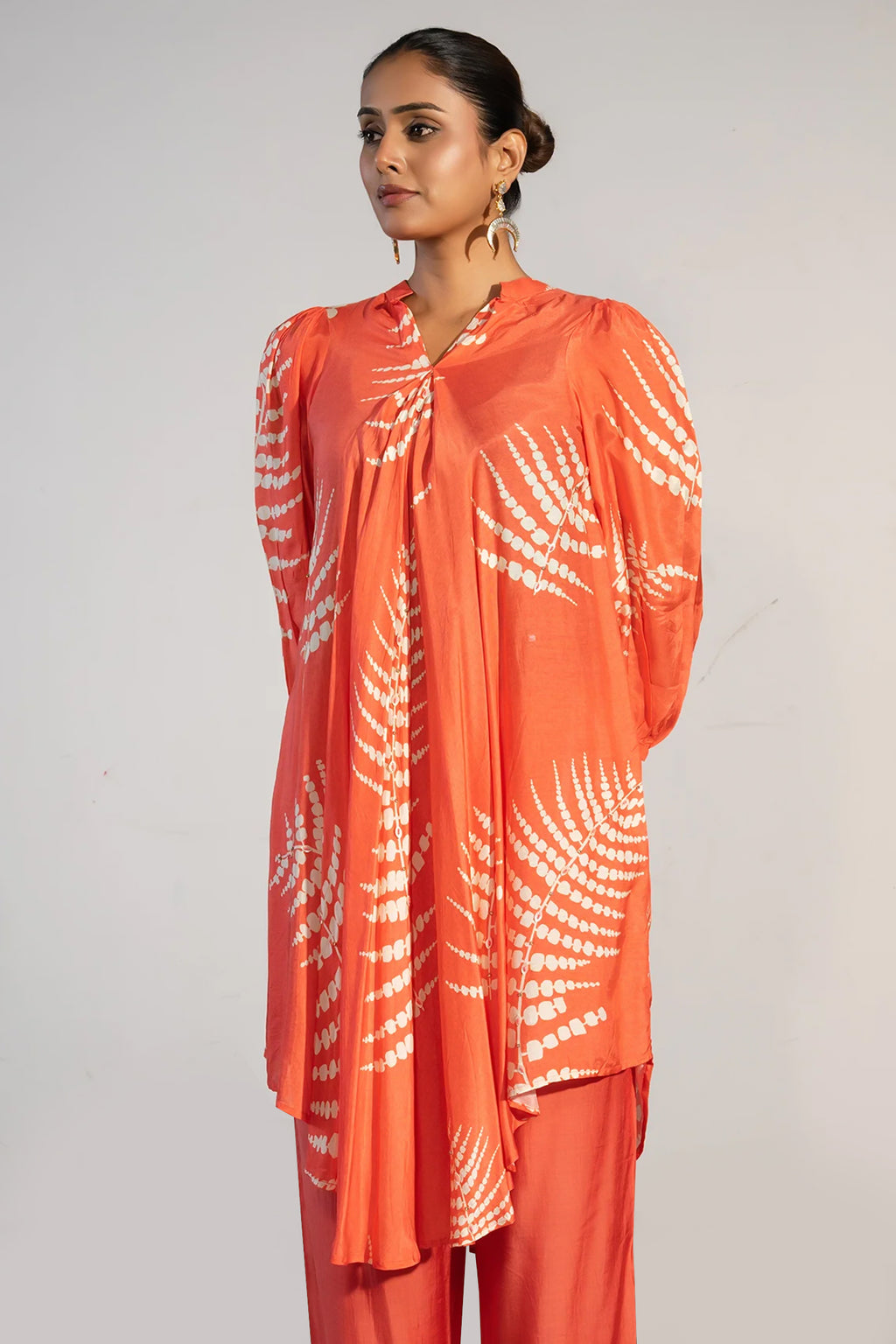 Close-up of the vibrant digital print on the Orange Crepe Printed Kurti with Pant