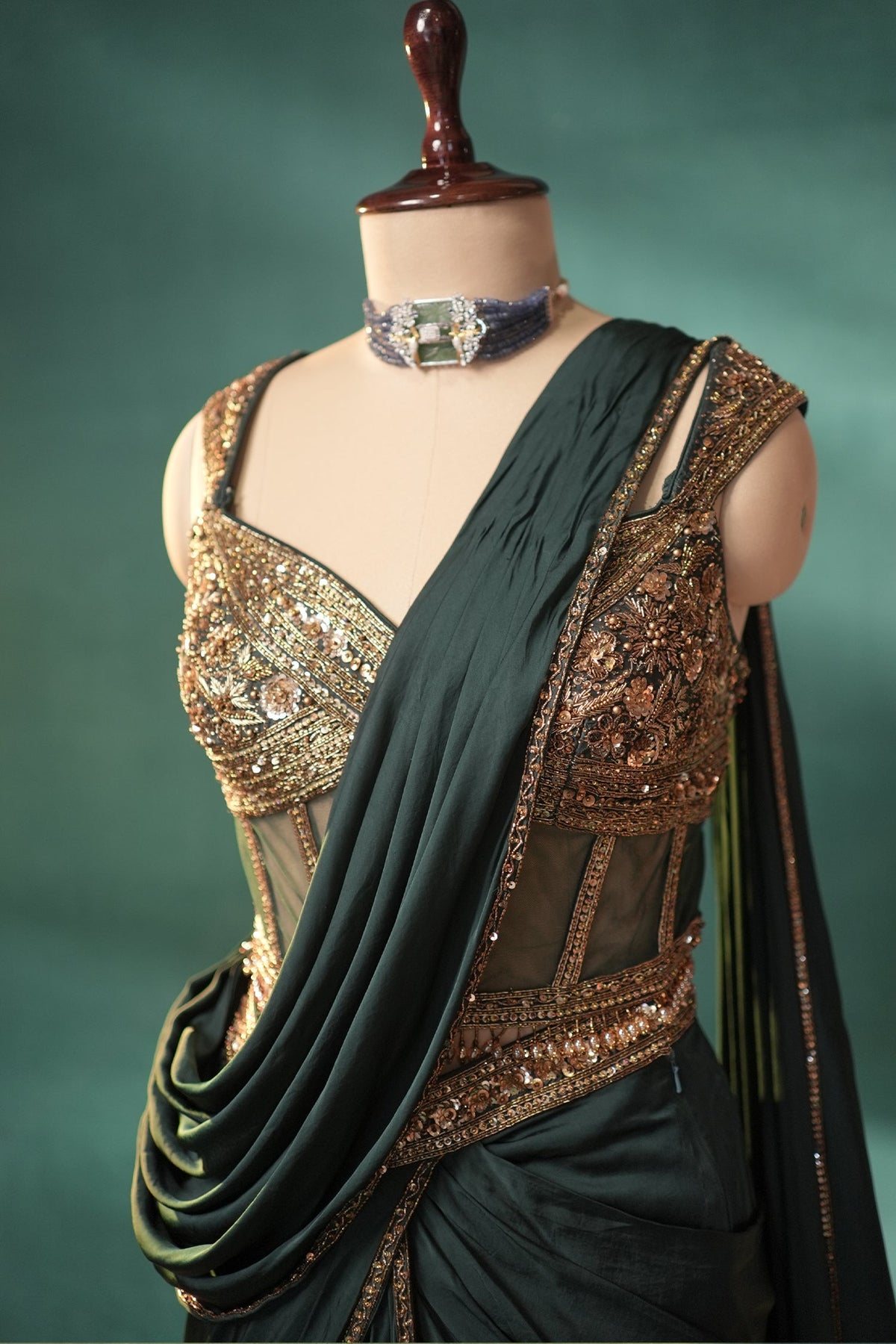 Bottle Green Crepe Satin Silk Pre Draped Lehenga Style Saree with Embellished Corset - green silk saree